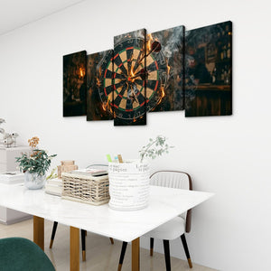 A 5-panel canvas wall art set depicting a dramatic, fiery dartboard scene, displayed on a white wall above a dining table in a modern room setting.