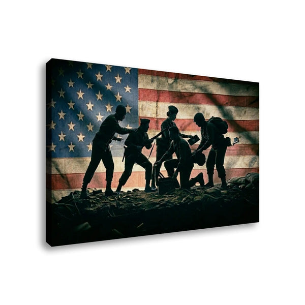 A rectangular wall art canvas showing a patriotic scene: silhouetted soldiers in the foreground against a large American flag background, photographed on a plain white studio background.