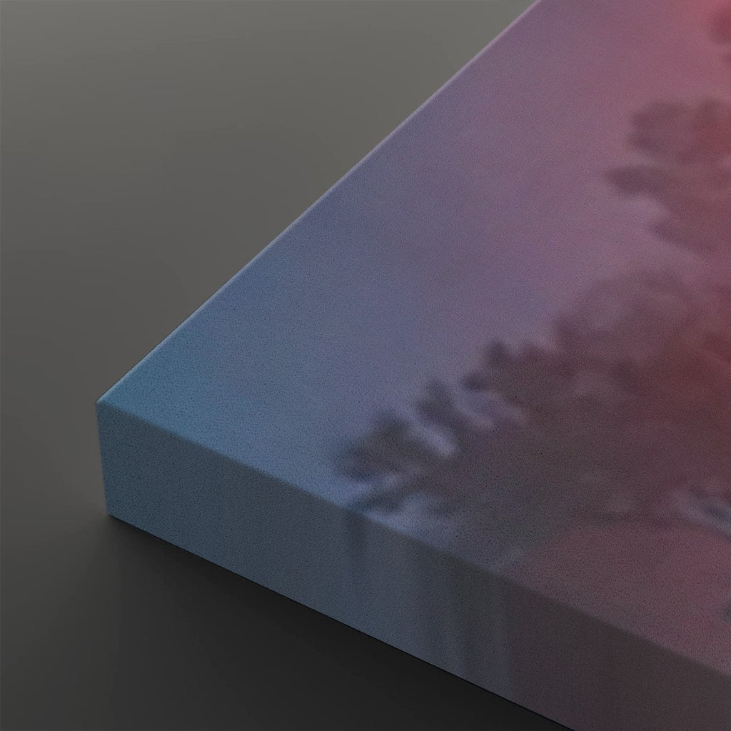 A close-up of a rectangular canvas or panel with a soft gradient surface shifting from light blue to pink and purple, with a blurred tree-like shadow printed across it. The product is shown at an angle on a dark gray background.