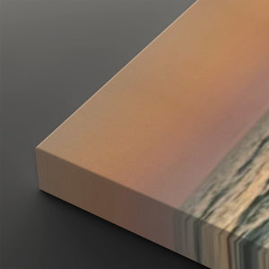 A close-up of a rectangular canvas or panel with a warm peach-to-pink gradient and a marbled stone-like pattern along one edge, shown against a dark gray background.