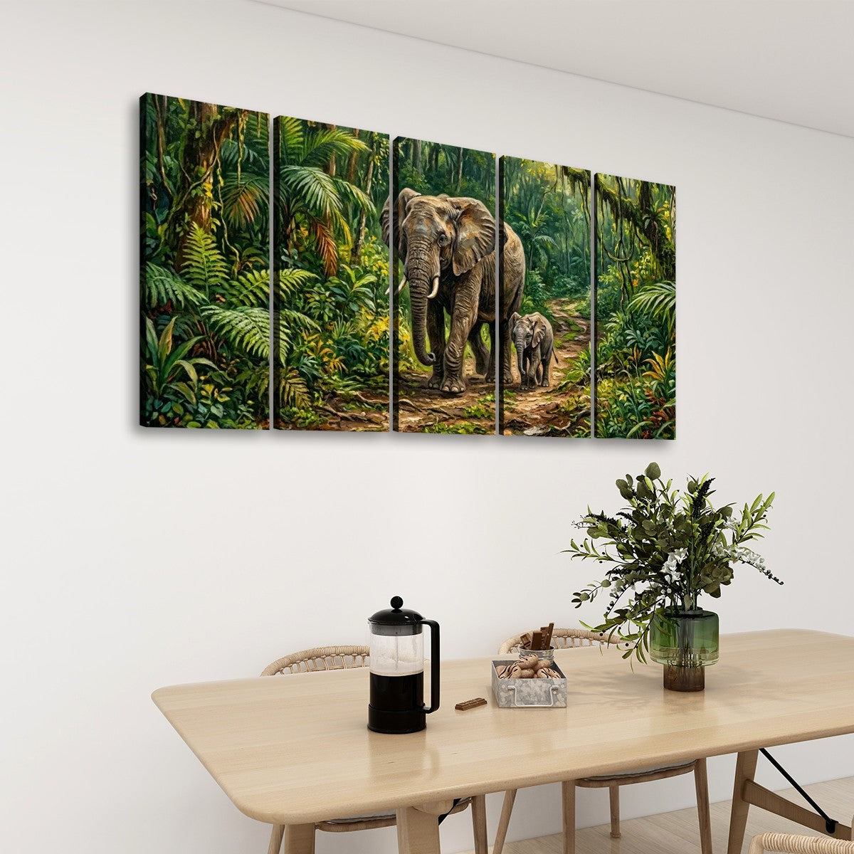 A five-panel canvas wall art set depicting a safari scene with an elephant and a calf in a lush green jungle, displayed on a white wall above a dining table with a plant and coffee maker.