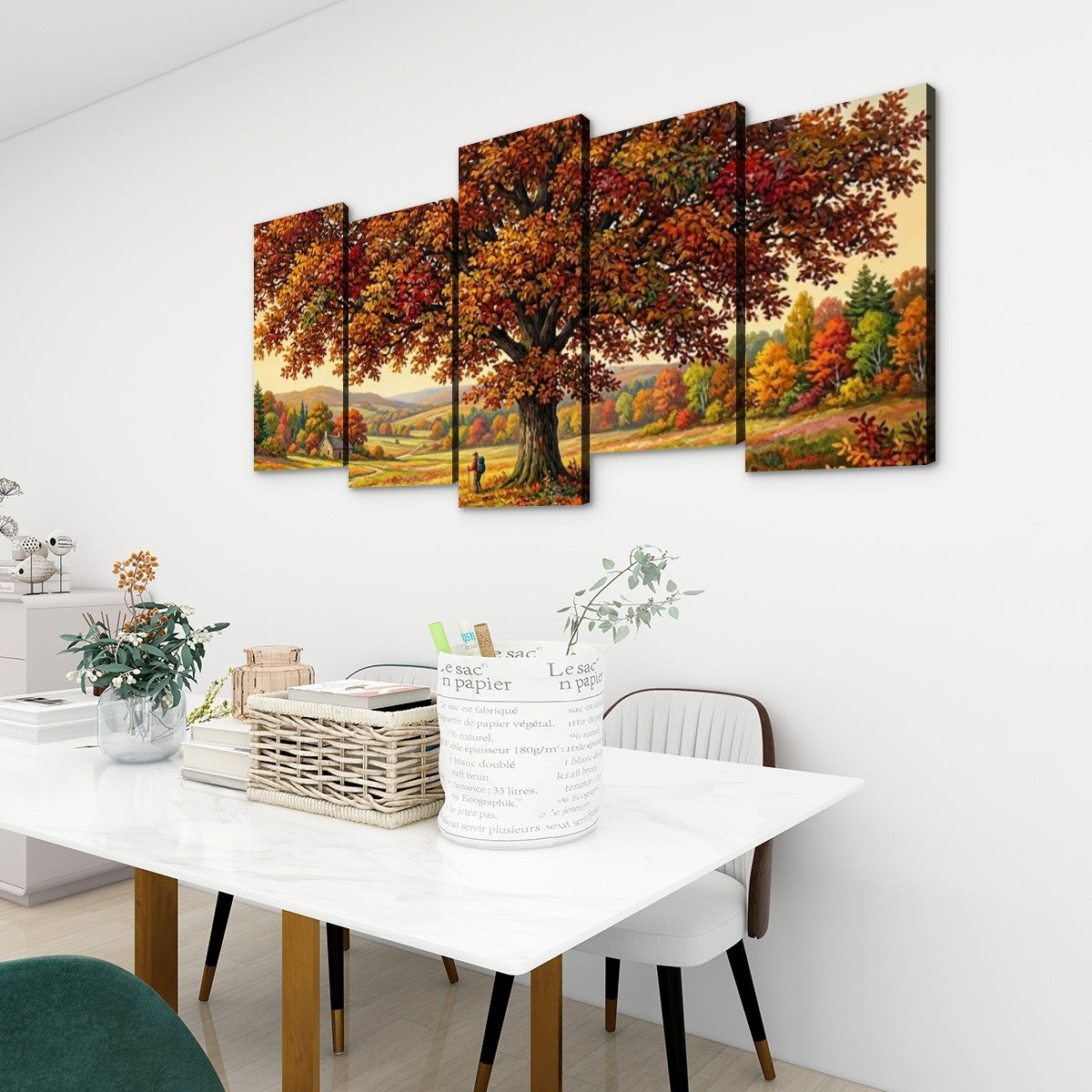 A 4-panel canvas wall art set depicting a large autumn tree with colorful foliage, displayed on a white wall above a dining table in a modern room setting.