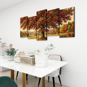 A 4-panel canvas wall art set depicting a large autumn tree with colorful foliage, displayed on a white wall above a dining table in a modern room setting.