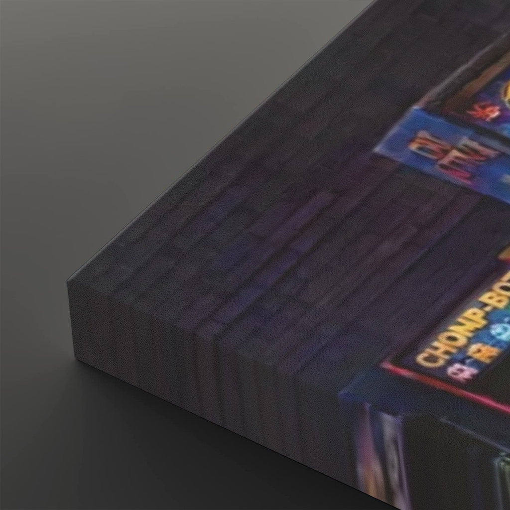 A close-up of a dark rectangular product, likely a book, box, or panel, showing a textured dark gray surface with a colorful printed label in the corner that reads 'CHAMPIONSHIP'.