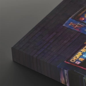 A close-up of a dark rectangular product, likely a book, box, or panel, showing a textured dark gray surface with a colorful printed label in the corner that reads 'CHAMPIONSHIP'.