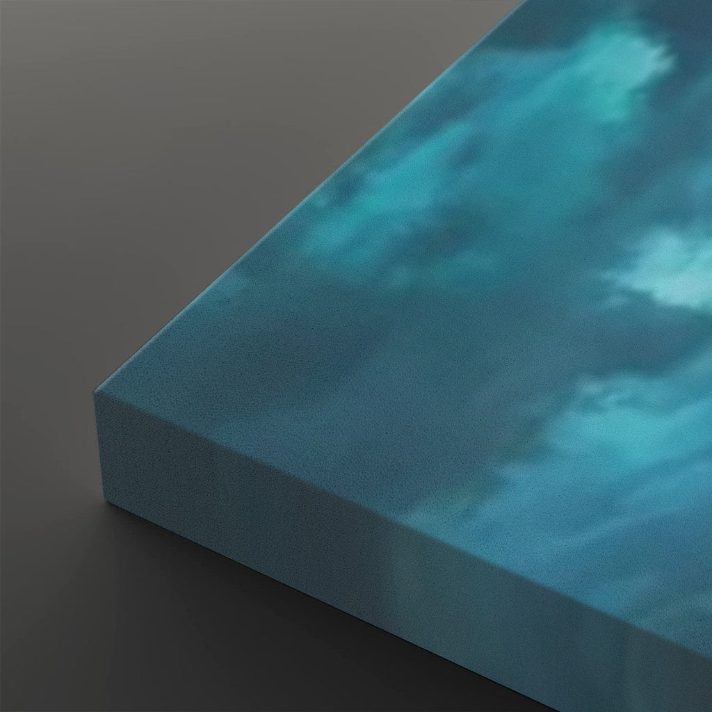A close-up of a square canvas print showing its wrapped edge, featuring a textured blue and teal cloudy sky design on a dark gray background.