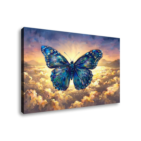 A rectangular canvas wall art print showing a large blue butterfly flying above glowing clouds at sunset, photographed against a plain white background.