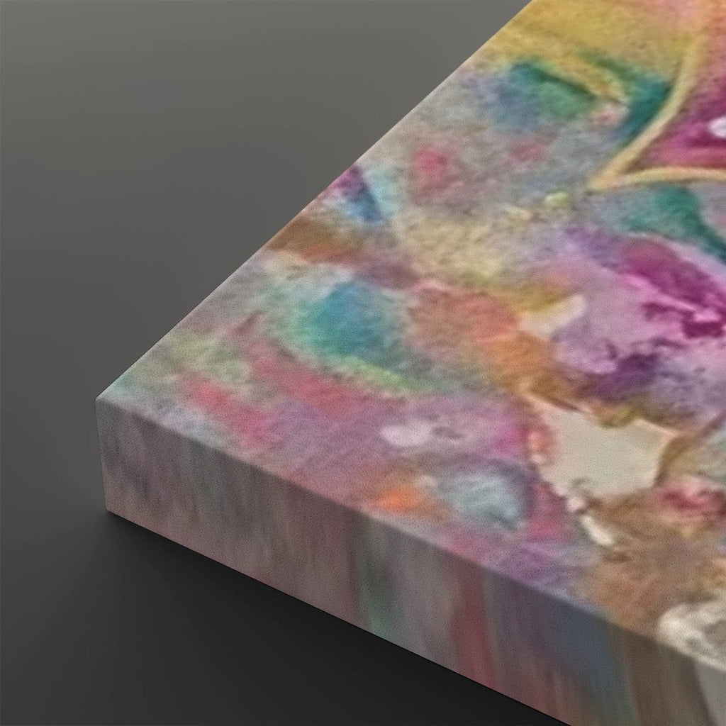 A close-up of a rectangular canvas or panel with an abstract multicolor painted surface, shown at an angle against a dark gray background.