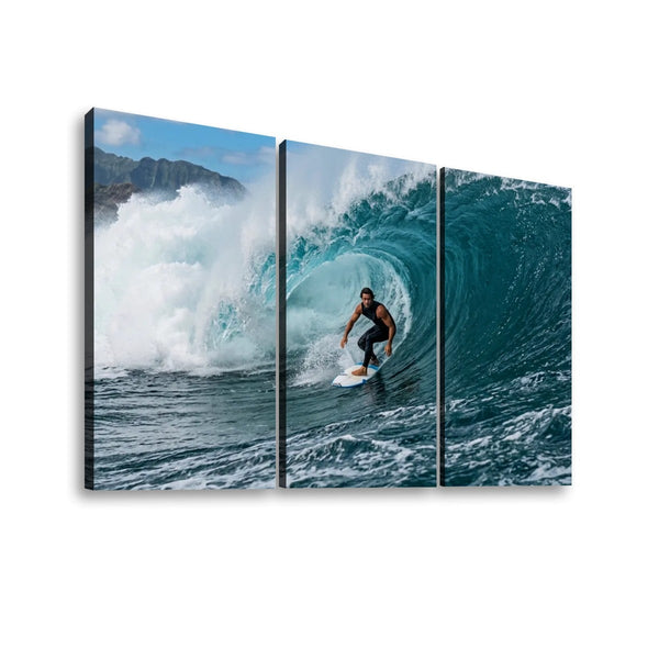 Three-panel canvas wall art showing a surfer riding inside a large ocean wave, displayed against a plain white background.