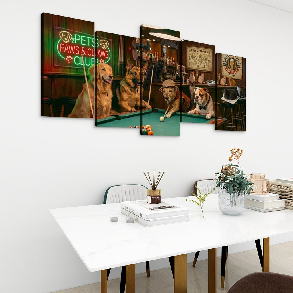 A 5-panel canvas wall art set depicting five dogs playing pool in a bar, displayed on a white wall above a modern white dining table with books and a vase.