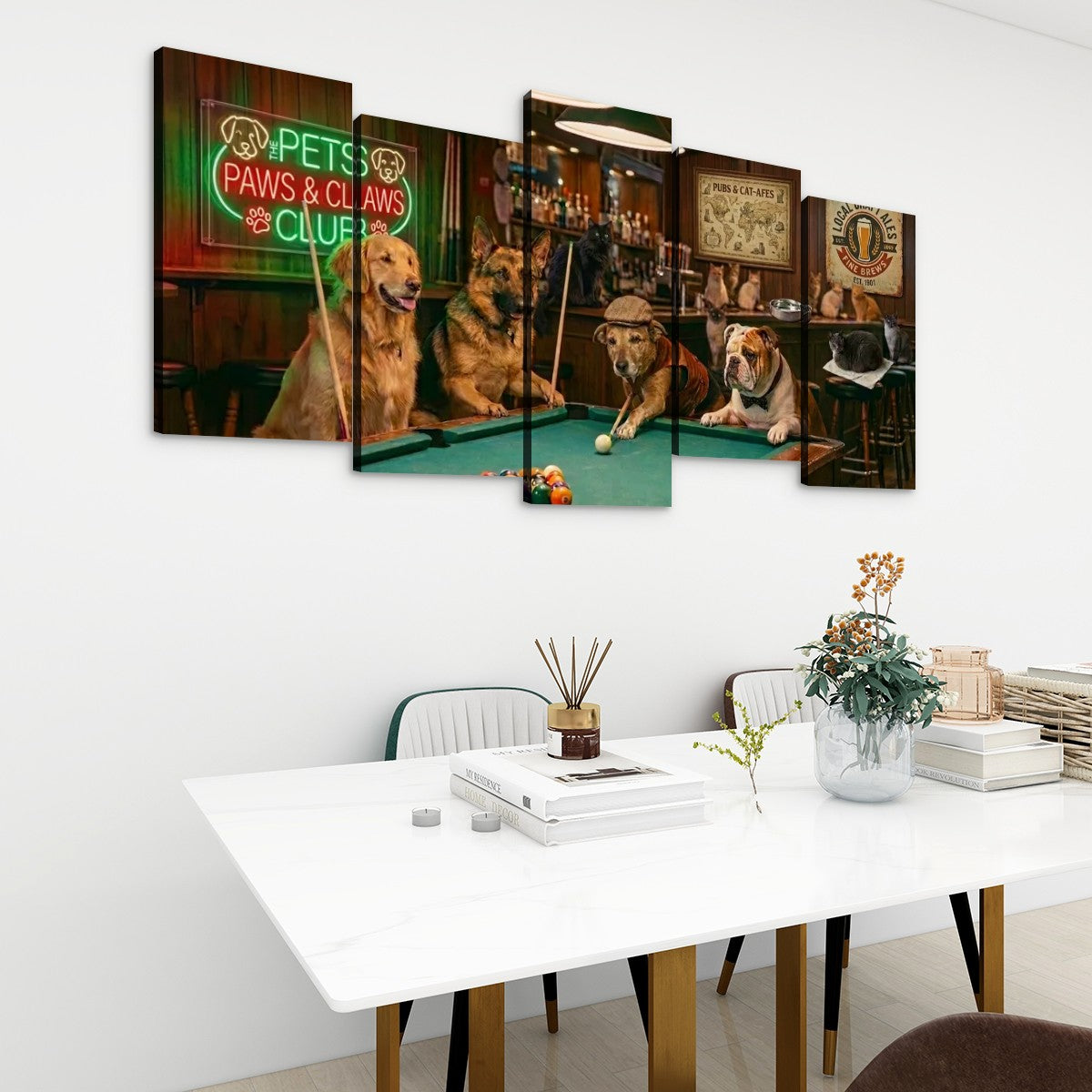 A 5-panel canvas wall art set depicting five dogs playing pool in a bar, displayed on a white wall above a modern white dining table with books and a vase.