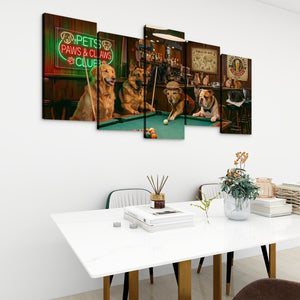 A 5-panel canvas wall art set depicting five dogs playing pool in a bar, displayed on a white wall above a modern white dining table with books and a vase.