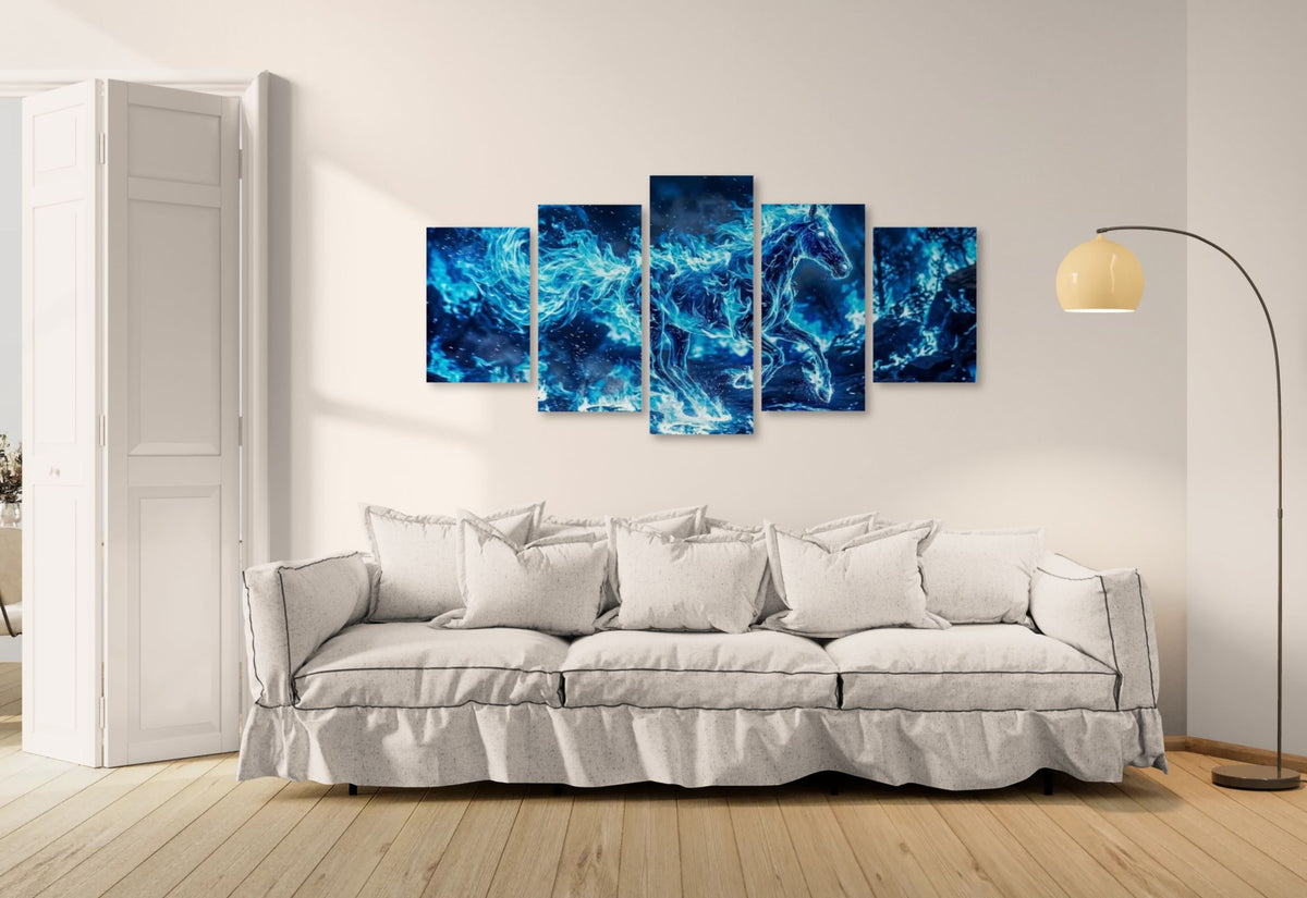 Five blue abstract horse paintings on a wall above a white sofa.