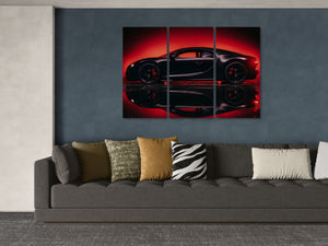 A three-panel canvas wall art print depicting a black Bugatti Chiron sports car against a dramatic red and black background, displayed on a dark blue-gray wall above a modern gray sofa with decorative pillows.