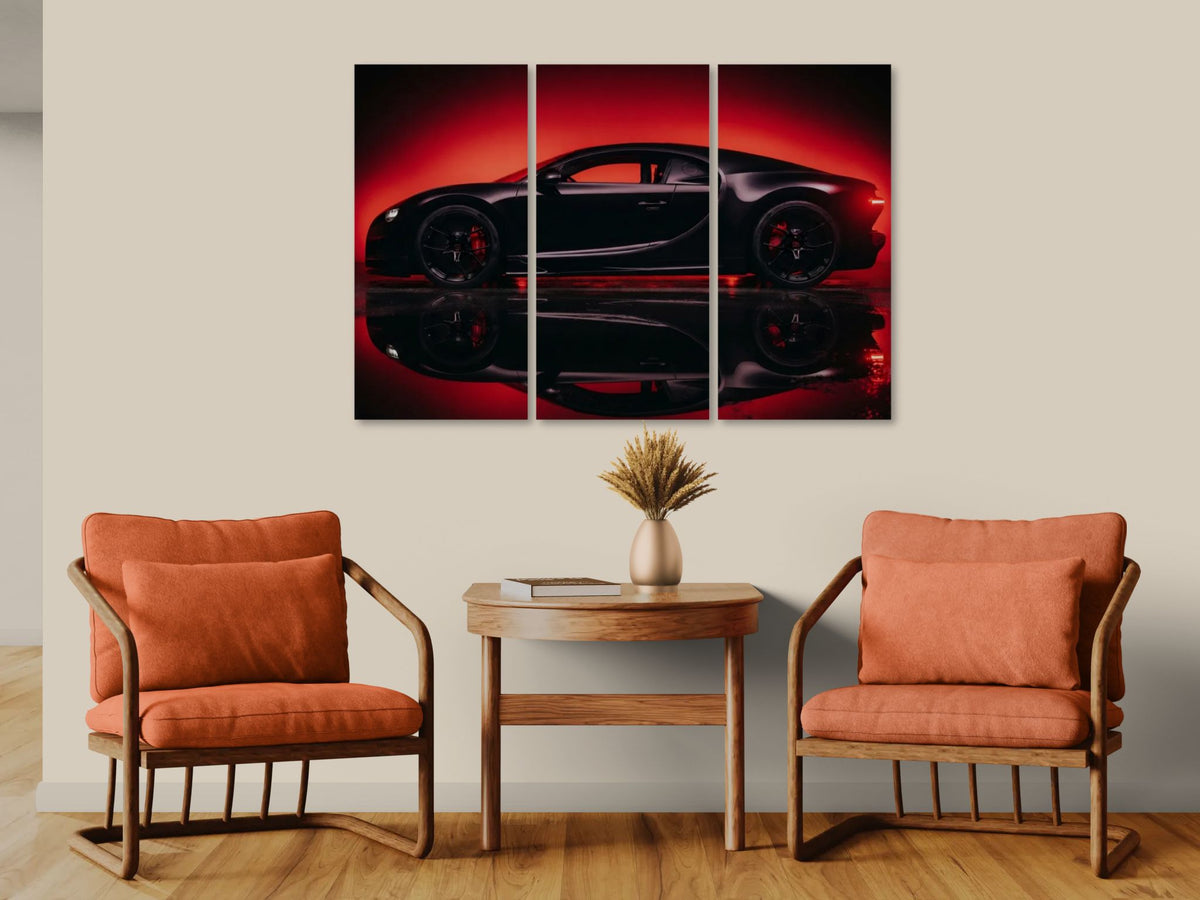 A three-panel canvas wall art print depicting a black Bugatti Chiron sports car in dramatic red lighting, displayed on a beige wall above a wooden side table with two orange armchairs.