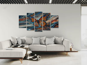 Modern living room with a large abstract butterfly painting on the wall.