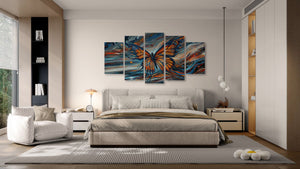 Modern bedroom with a large bed, sofa, and abstract butterfly artwork on the wall.