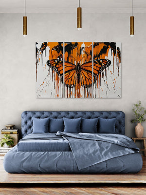Bedroom with a large abstract Monarch  butterfly painting on the wall above a bed.