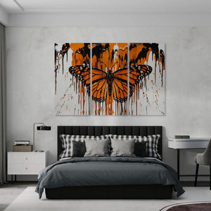 Modern bedroom with a large abstract Monarch butterfly painting on the wall.