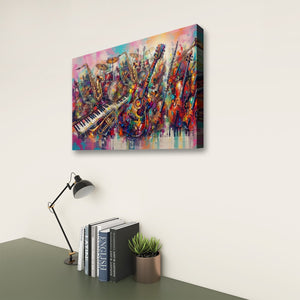 A colorful canvas wall art print depicting a jazz band with saxophones, trumpets, and guitars, shown hanging on a light beige wall above a desk with books, a lamp, and a small plant.