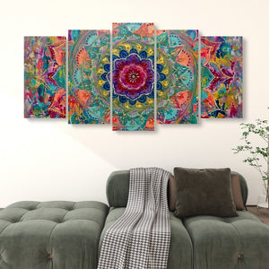 A five-panel canvas wall art set featuring a colorful abstract mandala design, displayed on a white wall above a green tufted sofa in a living room setting.