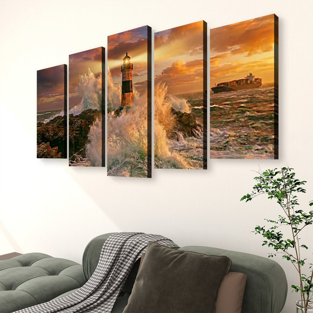 A five-panel canvas wall art set depicting a dramatic lighthouse and rocky shoreline at sunset, displayed above a green sofa in a living room setting.