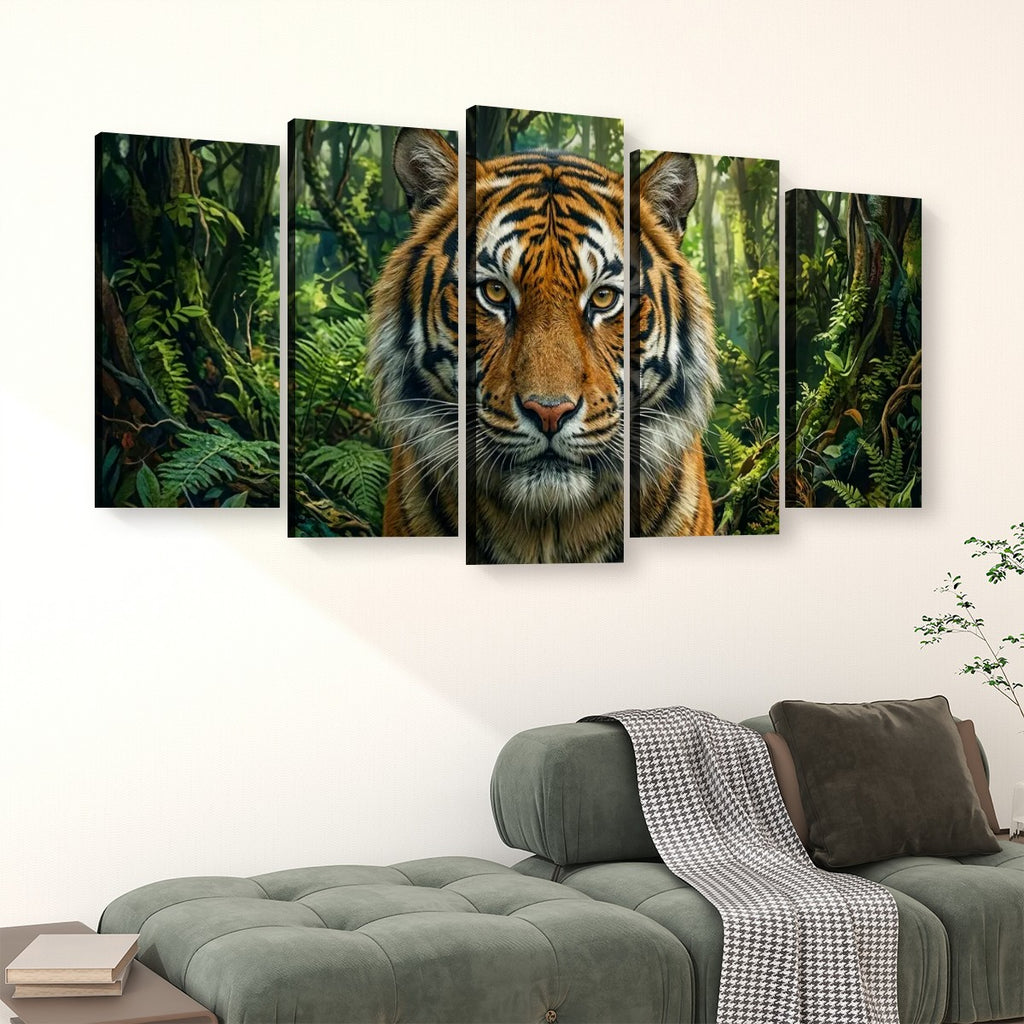 A five-panel canvas wall art set depicting a tiger's face in a lush green jungle, displayed above a modern gray sofa in a living room setting.