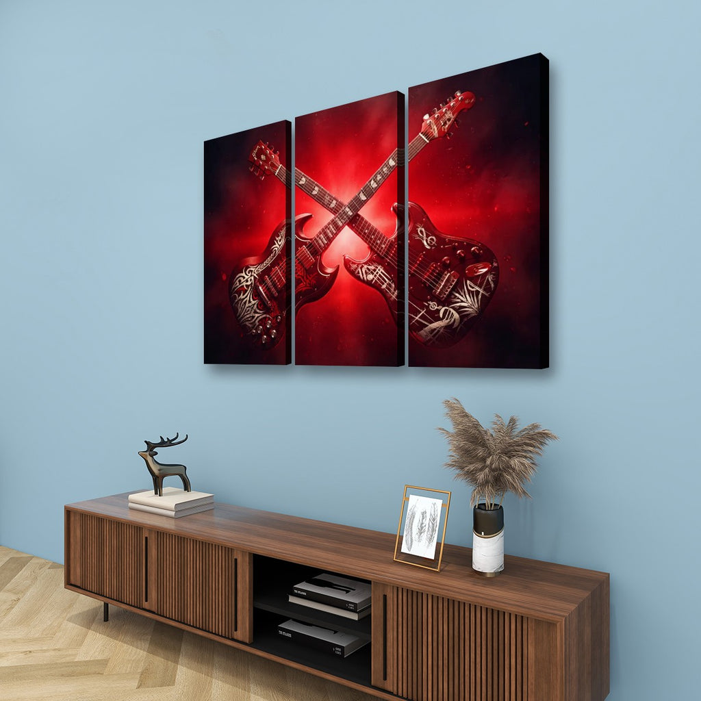 A three-panel canvas wall art set depicting two red electric guitars with tribal patterns, displayed on a light blue wall above a wooden console table with decorative items.