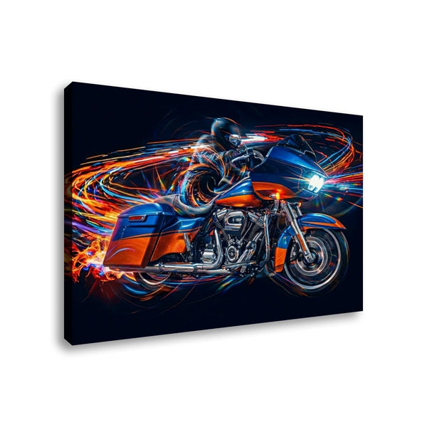 A rectangular wall art canvas showing a stylized motorcyclist riding a blue and orange Road Glide type motorcycle with glowing light trails on a dark background, photographed against a plain white wall.