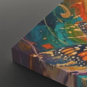A close-up of a colorful abstract canvas print showing a butterfly motif with teal, orange, purple, and gold tones, photographed on a dark gray background.