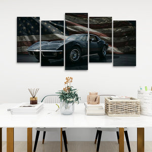 A five-panel canvas wall art print depicting a black 1972 Corvette sports car against a distressed American flag background, displayed on a white wall above a styled dining table.