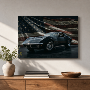 A framed wall art print showing a black sports car in front of a distressed American flag, displayed above a wooden console with books, a vase, and a bowl in a styled interior.
