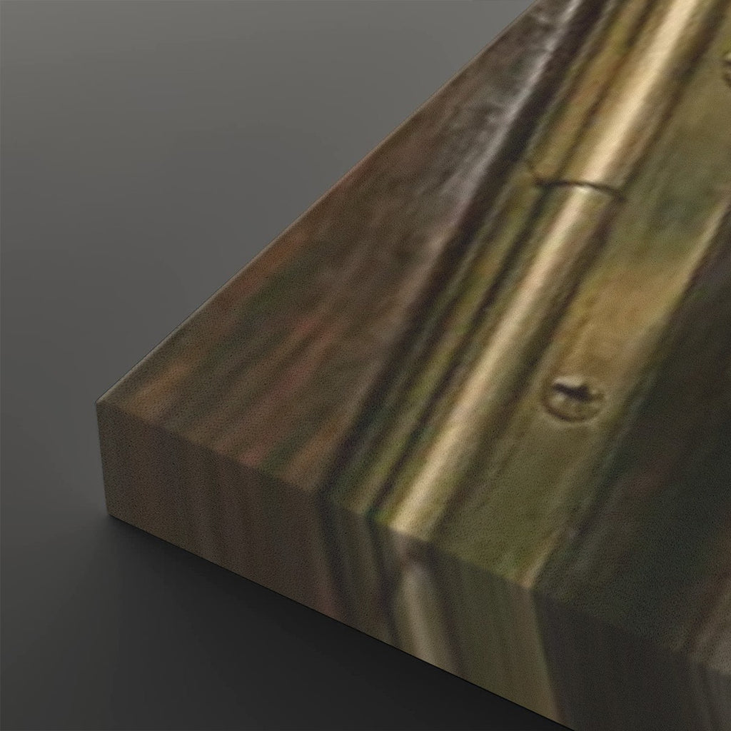 A close-up of a rectangular wooden block or panel with visible wood grain, knots, and a screw fastener, photographed on a dark gray background.
