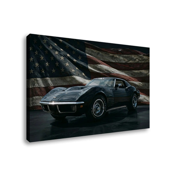 A rectangular wall art print or canvas showing a black 1972 Corvette classic sports car in front of a large American flag, photographed against a plain white background.