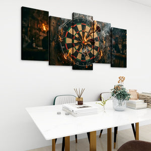 A 5-panel canvas wall art set depicting a burning dartboard in a dimly lit bar, displayed on a white wall above a modern dining table with chairs and decorative items.