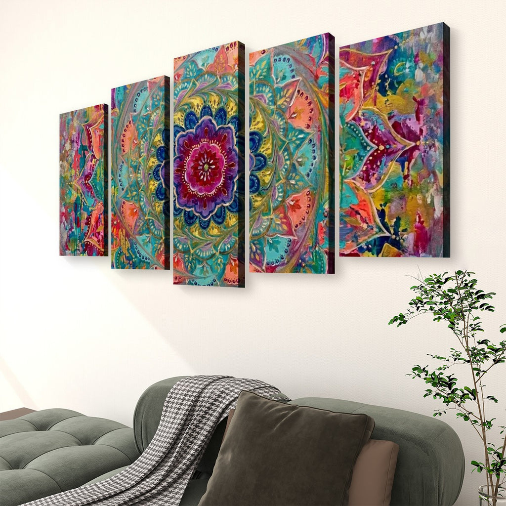 A five-panel canvas wall art set featuring a vibrant, colorful mandala and floral pattern, displayed on a white wall above a green sofa in a living room setting.