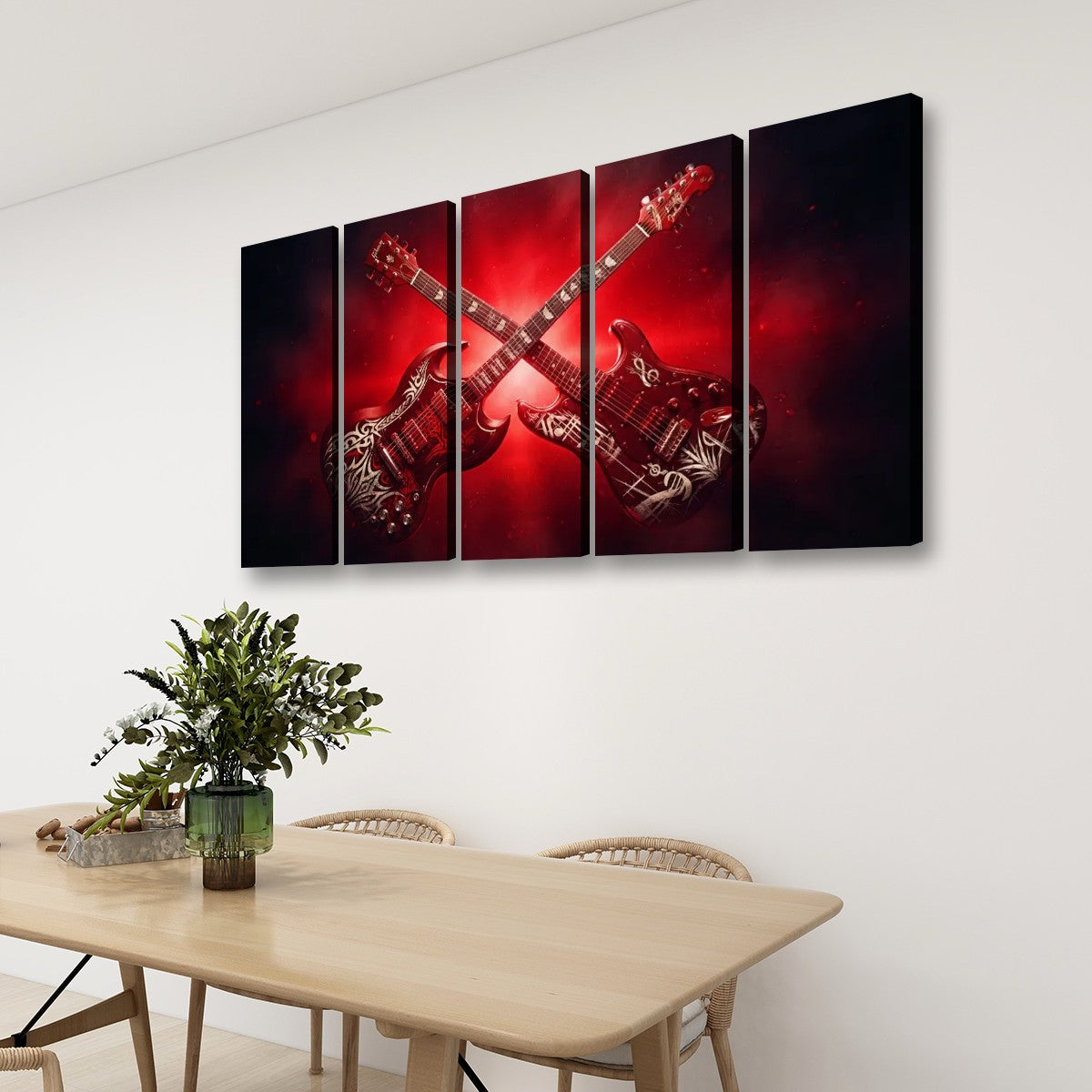 A 4-panel canvas wall art set depicting two crossed electric guitars against a dramatic red and black background, displayed on a white wall above a wooden dining table with chairs and a plant.