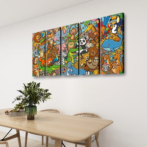 A multi-panel canvas wall art set featuring a colorful cartoon jungle animal illustration, displayed on a white wall above a wooden dining table with chairs and a potted plant.
