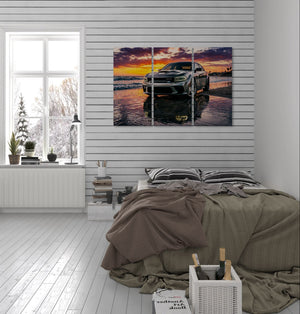 Bedroom with a large wall art of a sunset over water and a Dodge Charger SRT Hellcat.