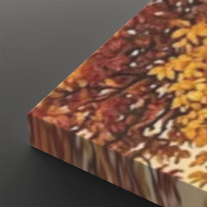 A close-up of a rectangular canvas or panel printed with an autumn tree pattern, showing warm red, orange, yellow, and brown leaves against a dark gray background.