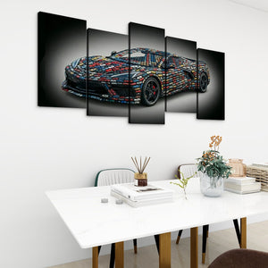 A 5-panel canvas wall art set depicting a colorful mosaic sports car on a black background, displayed in a modern dining room setting above a white table.