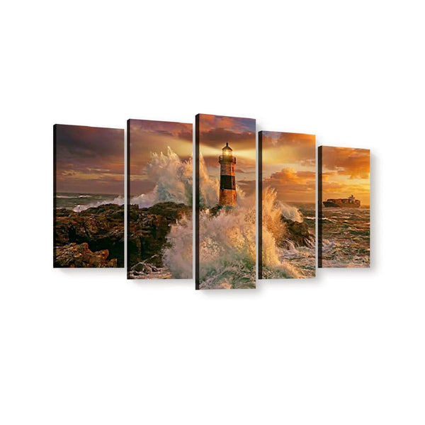 Five-panel canvas wall art showing a dramatic lighthouse scene at sunset with crashing waves and rocky shoreline, displayed against a plain white background.
