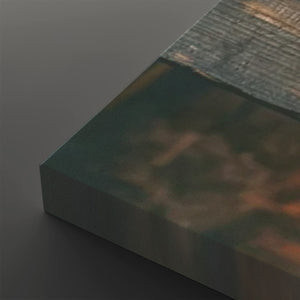 A close-up of a rectangular panel or block with a dark green and brown marbled or textured surface, shown at an angle on a dark gray background.