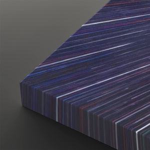 A close-up of a rectangular panel with a dark abstract striped pattern in navy, purple, blue, and white, shown at an angle on a dark gray background.