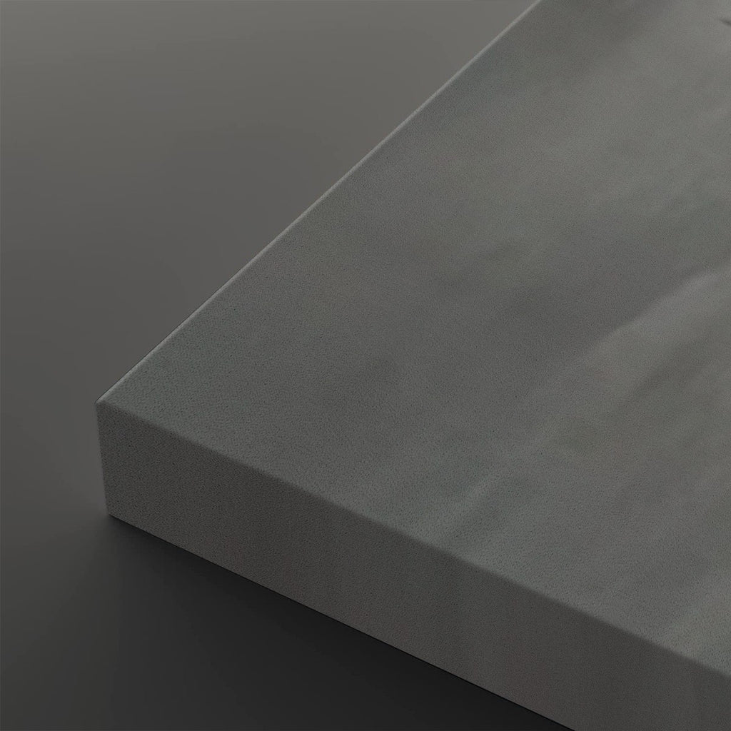 A close-up of a matte gray rectangular panel or tile corner, shown against a matching dark gray background.
