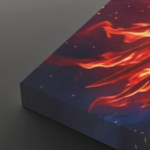 A close-up of a rectangular canvas or print showing a dramatic abstract scene with glowing orange and red flame-like streaks over a dark blue to purple background with small light specks, photographed on a dark gray surface.