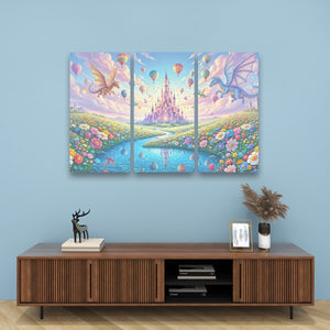 A three-panel canvas wall art set depicting a whimsical fantasy landscape with a castle, dragons, hot air balloons, and a river, displayed on a light blue wall above a wooden console table.