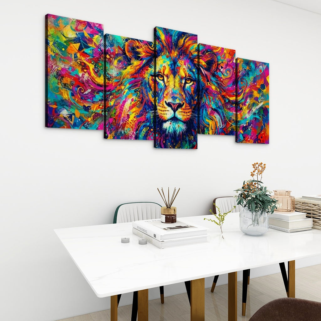 A five-panel canvas wall art set depicting a colorful, vibrant lion portrait in an abstract, painterly style, displayed on a white wall above a modern dining table with chairs and decorative items.