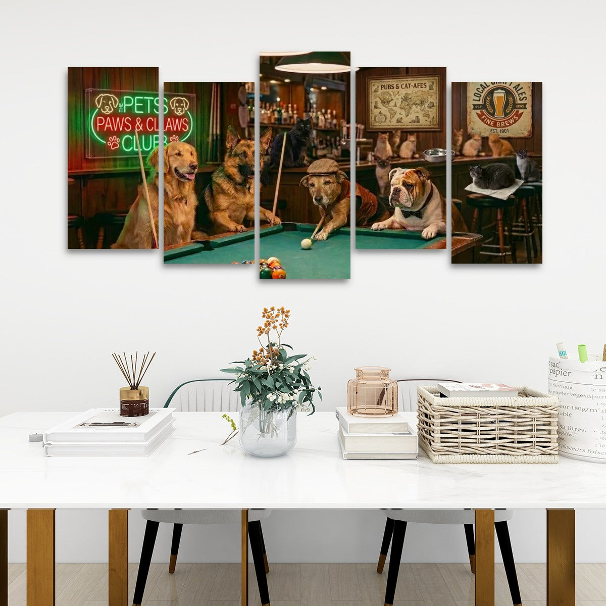 A five-panel canvas wall art set depicting playful dogs playing pool in a bar, displayed on a white wall above a modern white dining table with books, a vase, and baskets.