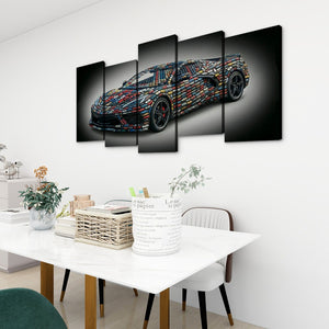A multi-panel canvas wall art set depicting a colorful mosaic sports car on a black background, displayed above a white dining table in a modern room setting.